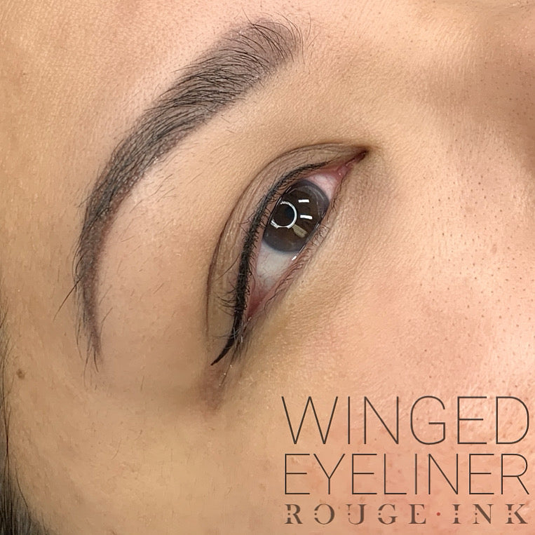 A female client who received semi-permanent eyeliner with a wing.