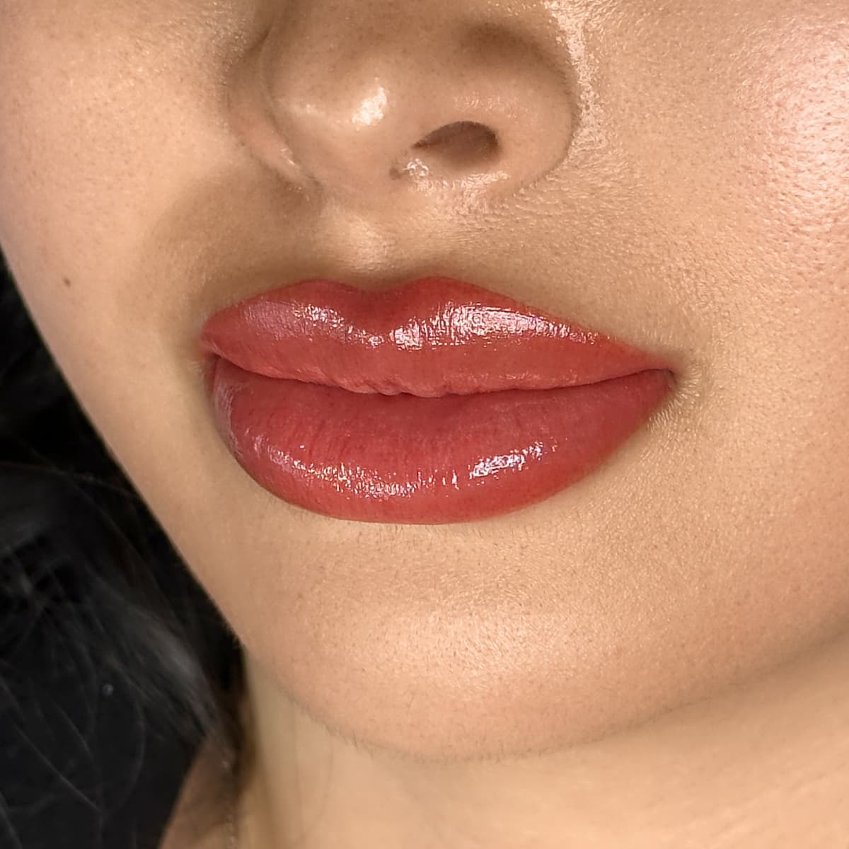 Close-up of lip blush treatment at Rouge Ink, enhancing natural lip color and shape for a fuller, youthful appearance.