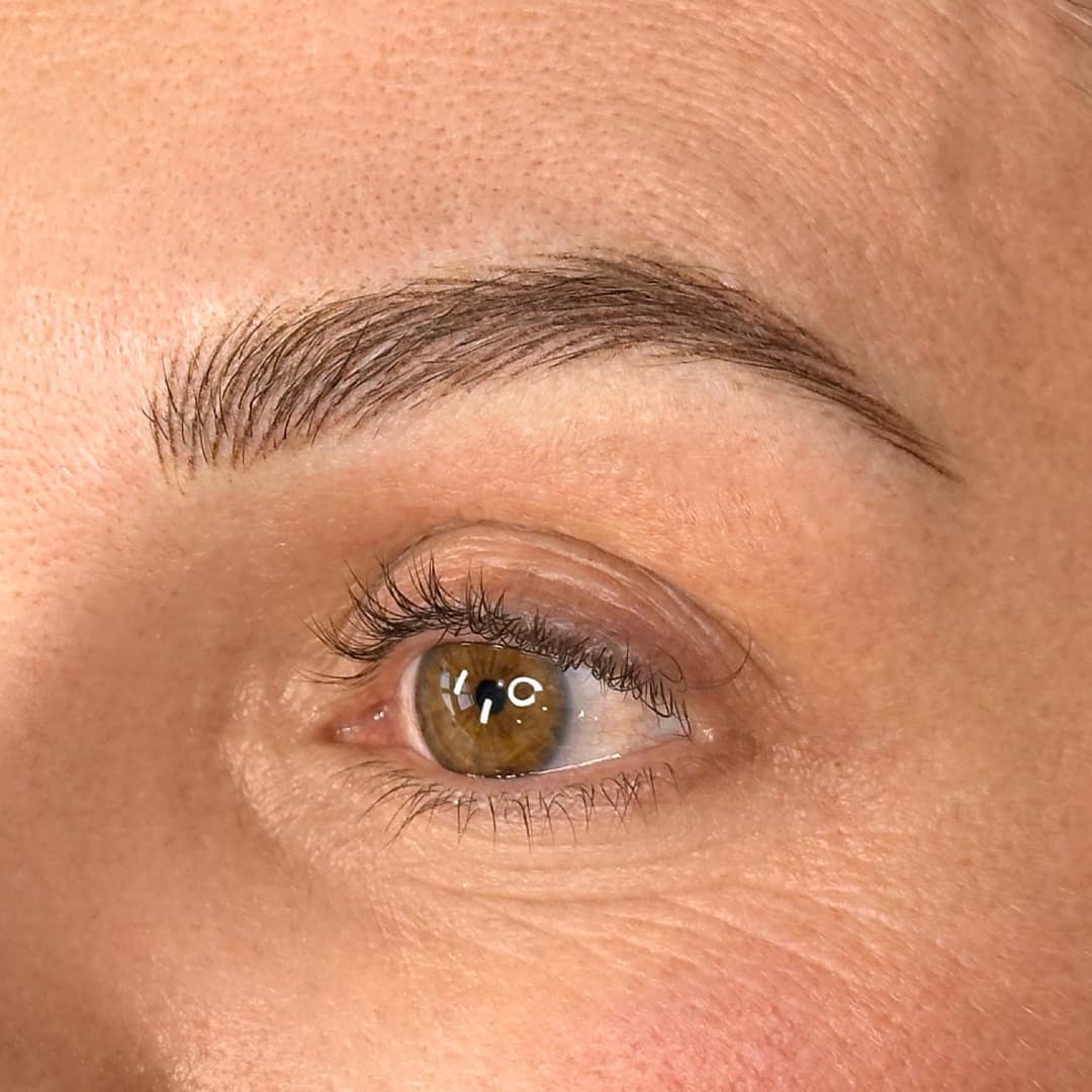 Close-up of nano brows treatment at Rouge Ink, showing fine hair-like strokes for natural and fuller brow enhancement.